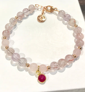 Super Seven Gemstone Bracelet with Ruby Charm and Rose Quartz